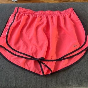 Bright coral Nike dri-fit shorts